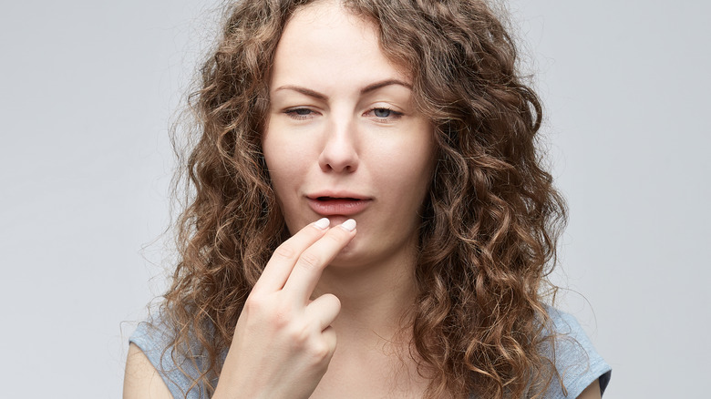 woman with funny taste in mouth