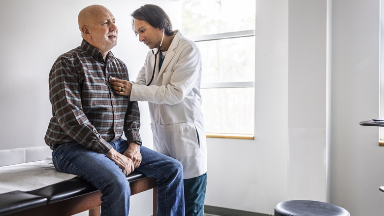 Man having his heart checked by a doctor