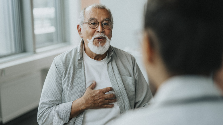 Relieved man talking to his doctor