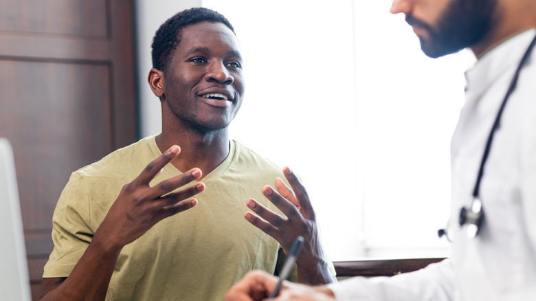 man talking to doctor