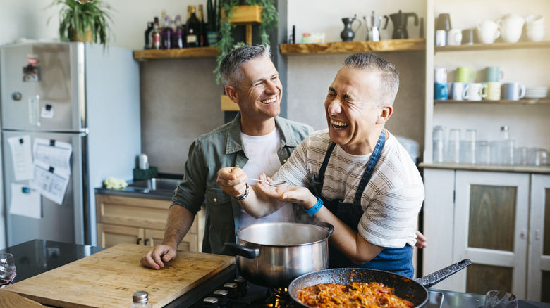 same-sex male couple preparing healthy meal