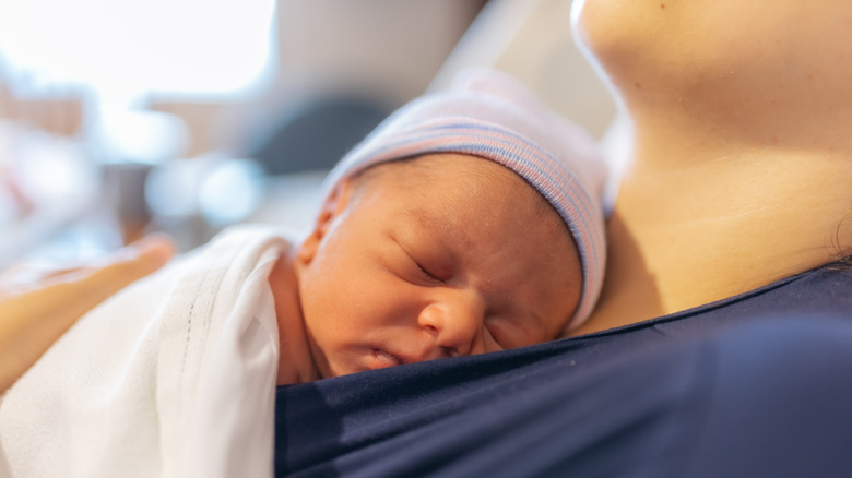 Newborn baby on chest