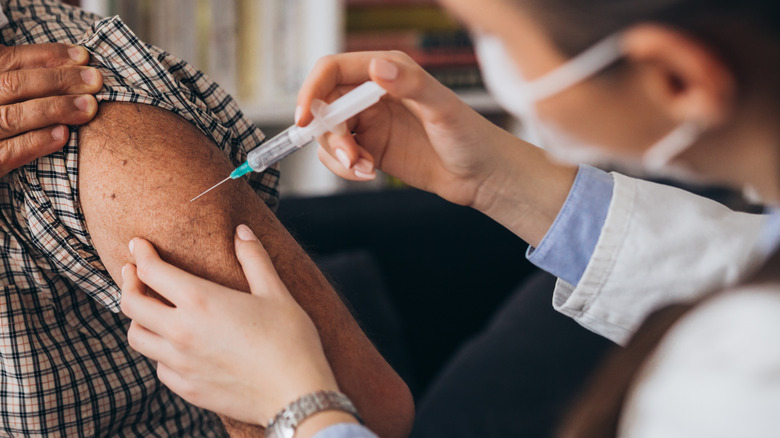 Doctor administering vaccine