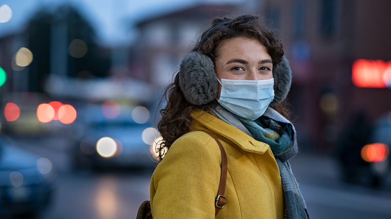 woman wearing a mask in winter