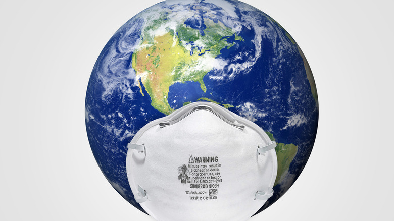 globe wearing mask