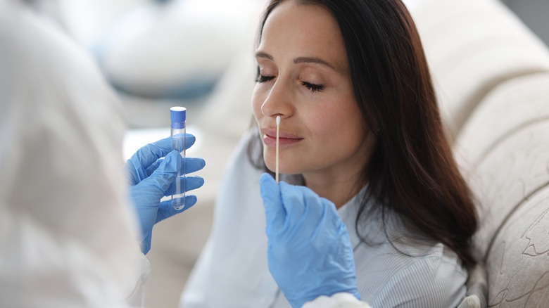 woman receiving covid test