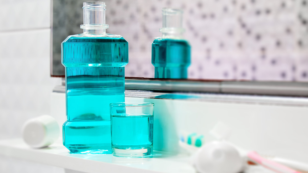 Bottle of mouthwash on bathroom shelf