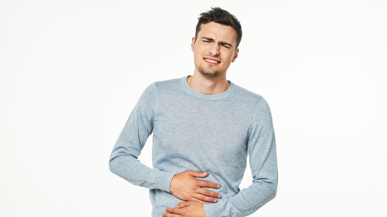 Man with a stomachache from overeating