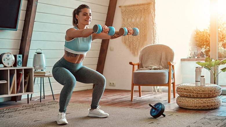 happy woman working out indoors