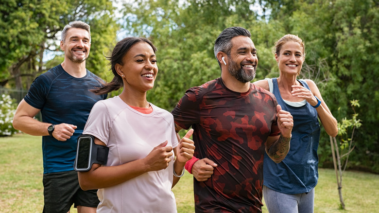 group of people running outdoors