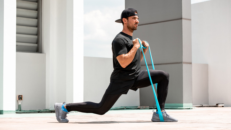 man doing workout with resistance band