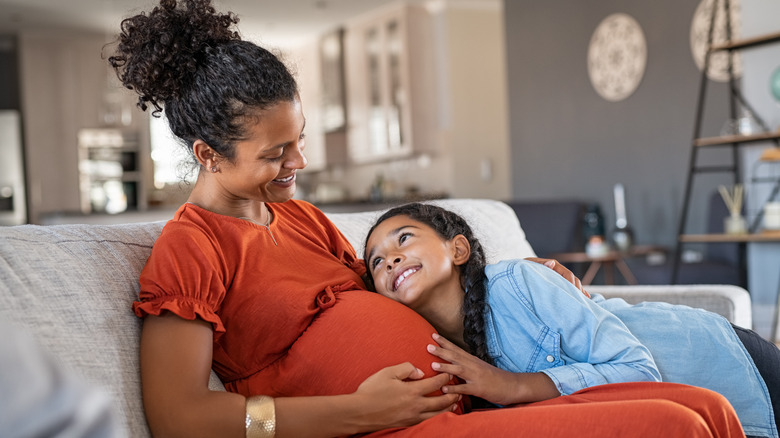 pregnant mother with child