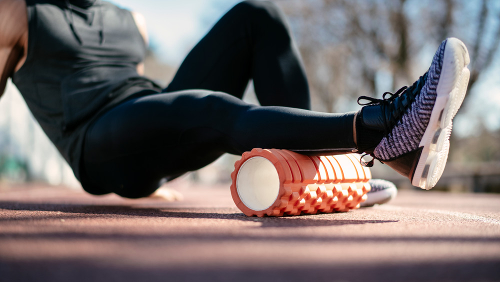 man foam rolling