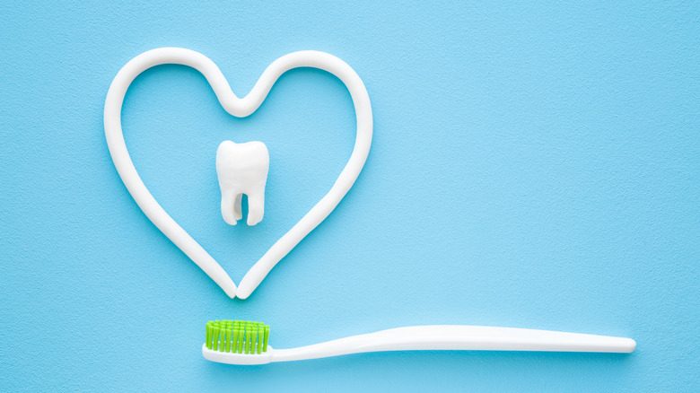 tooth and heart shape with toothbrush