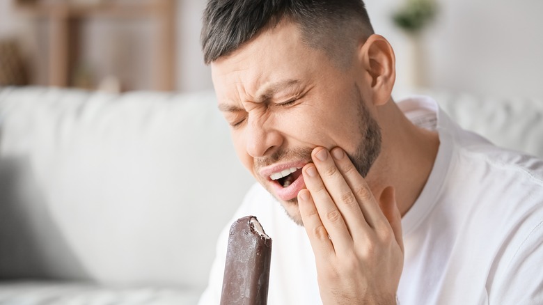 man with sensitive teeth and ice cream bar