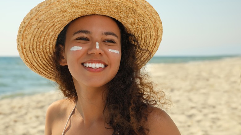 woman with sunscreen on face