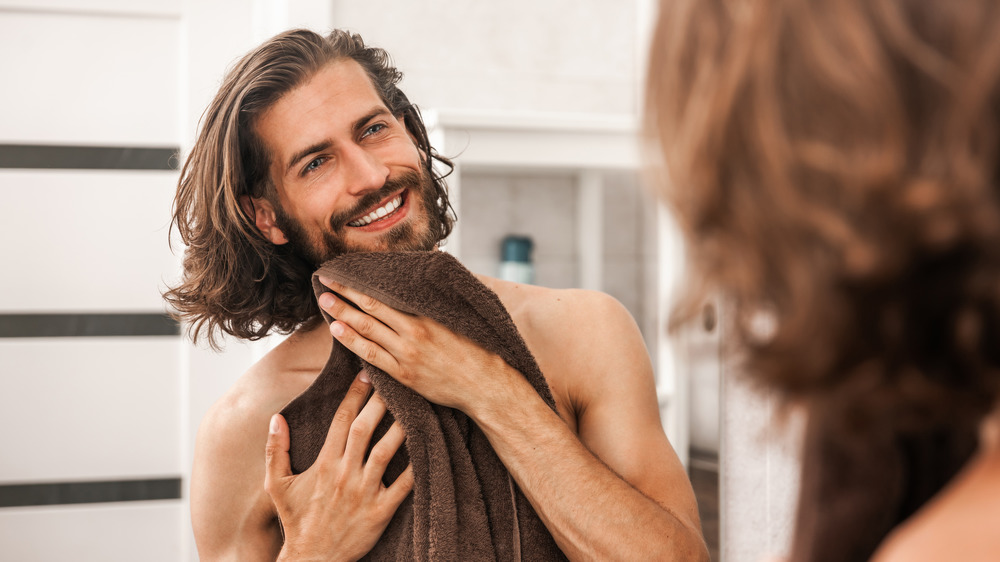 Man washing beard 