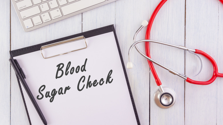 blood sugar check on clipboard