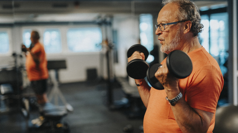 Older man lifting weights