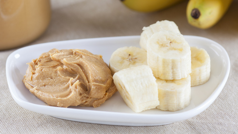 plate of peanut butter and sliced banana