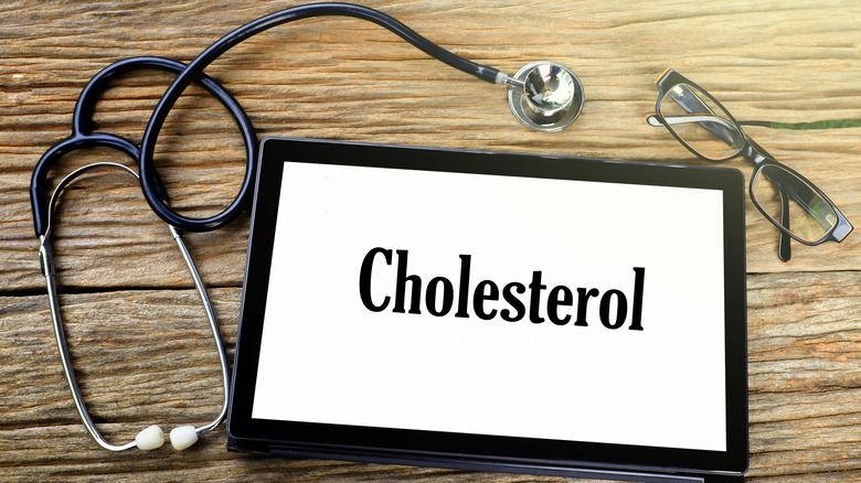cholesterol sign with stethoscope and glasses