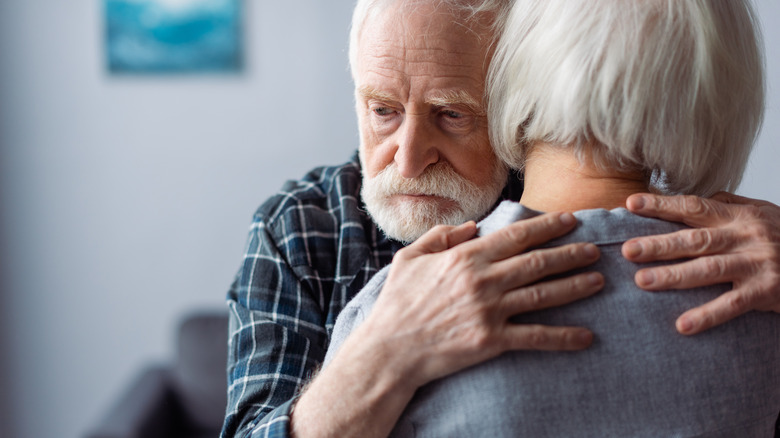 older man hugging older woman