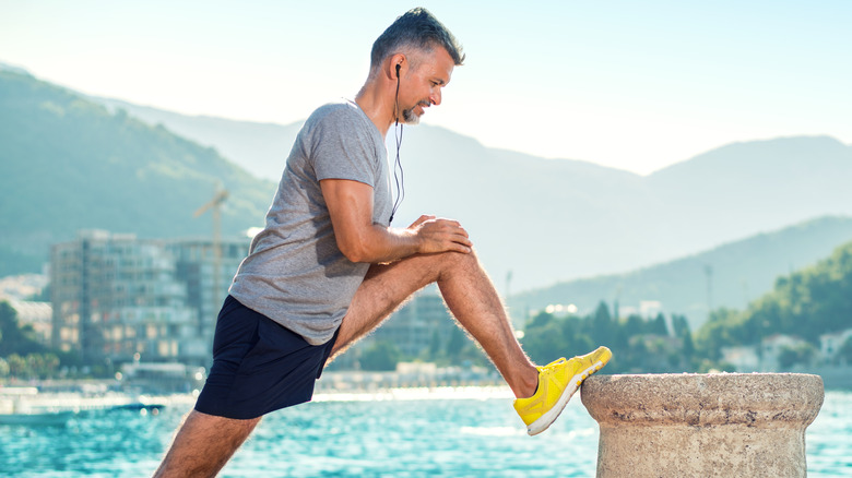 man stretching before exercise outside