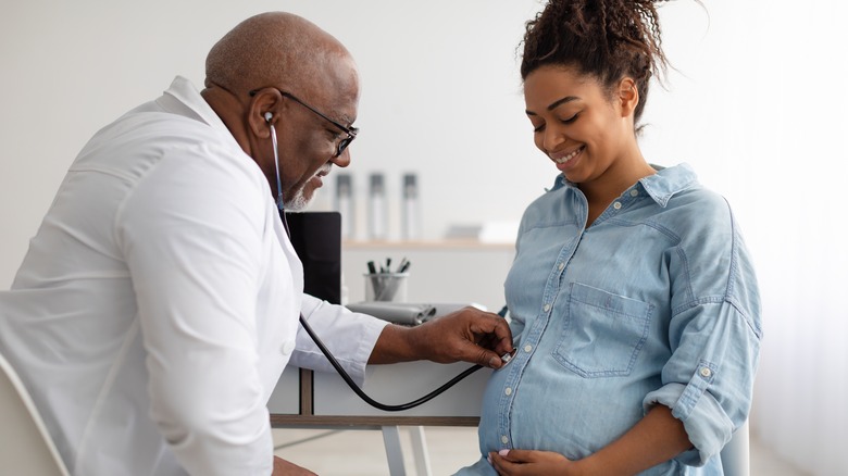 pregnant woman with doctor