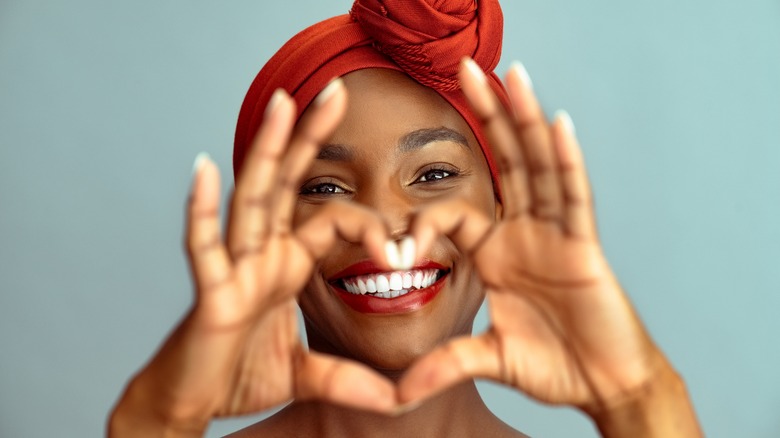 woman holding heart shape