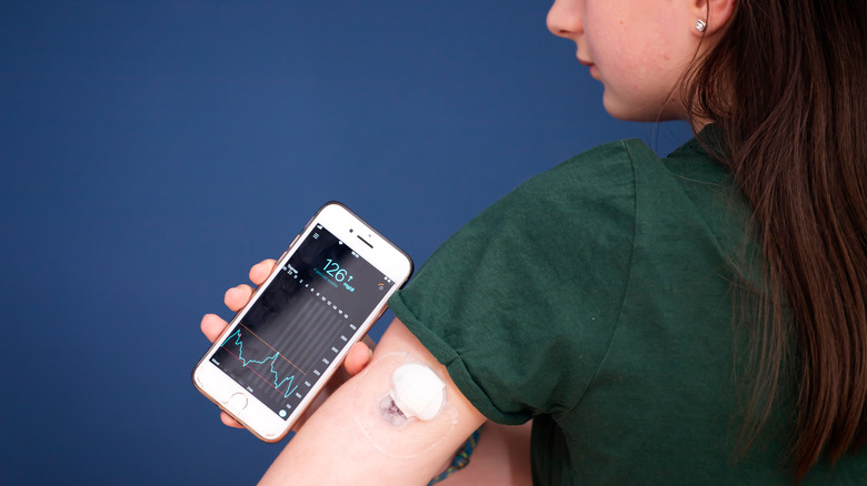 woman checking her blood sugar levels