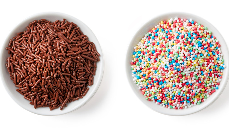 Two white bowls of ice cream sprinkles