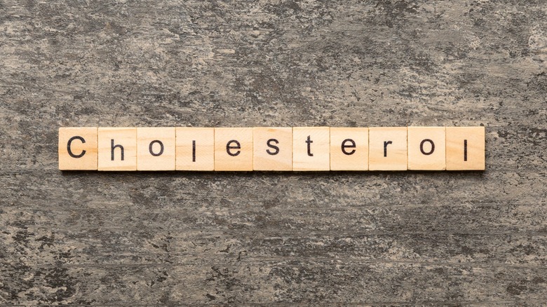 "Cholesterol" spelled out on wood blocks