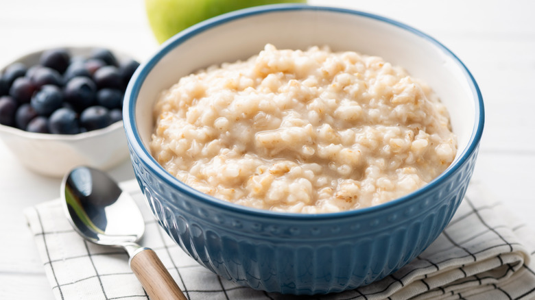 Oatmeal in a bowl by a spoon