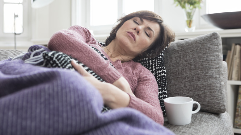 Exhausted woman resting at home