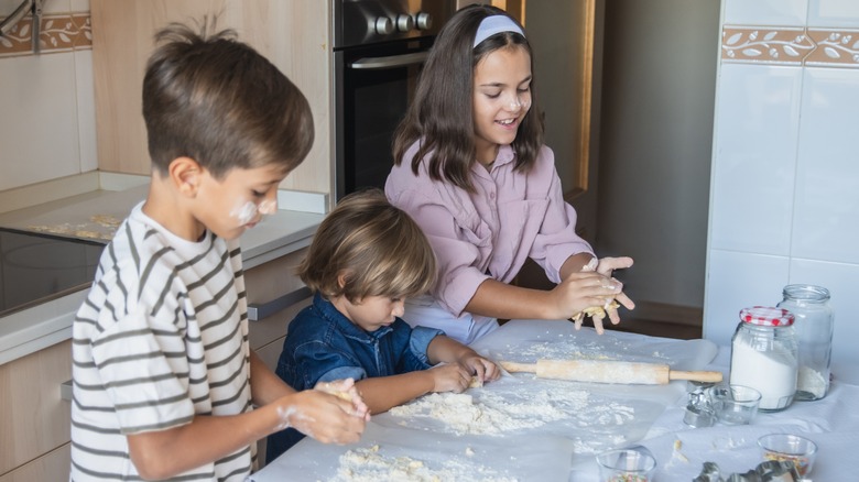 Kids cooking with flour when making cookies