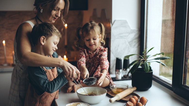 Kids with their mom making cookies