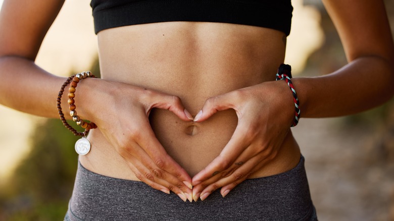 Woman making heart shape with hands