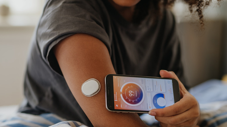 Girl checking blood sugar levels