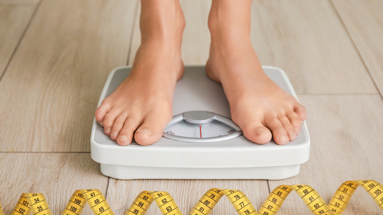 woman standing on a home scale