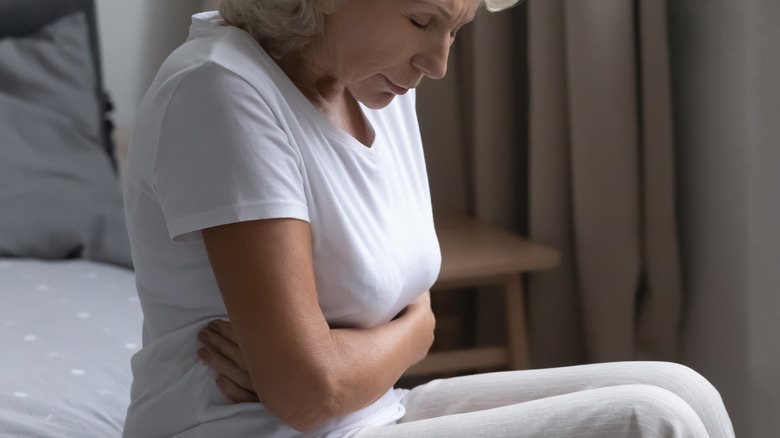 older woman with stomach discomfort