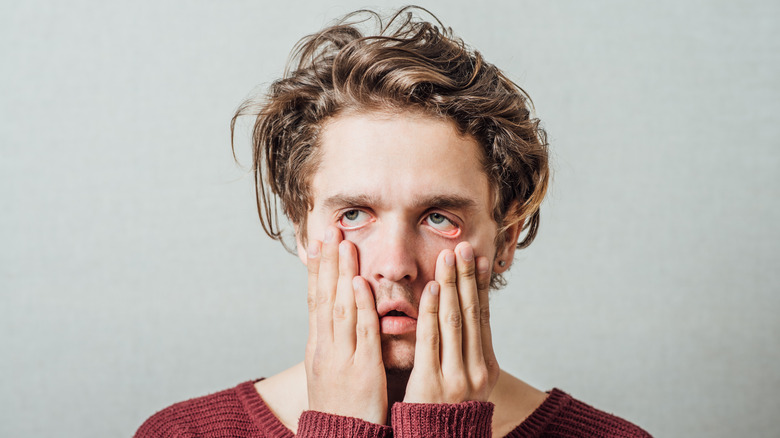 man looking tired and stressed from anxiety and worry