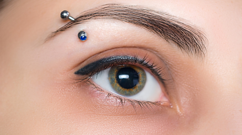 close up of a woman's pierced eyebrow