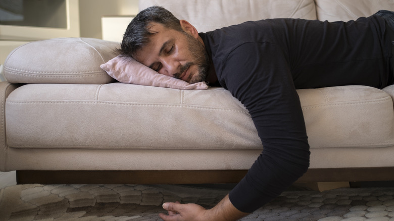 A man crashed out on his sofa