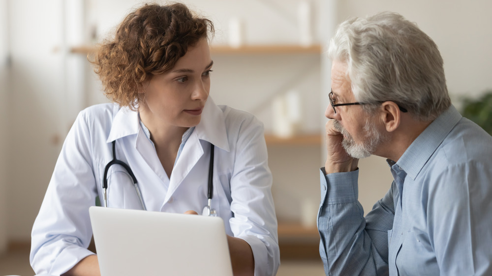 doctor giving patient medical consultation