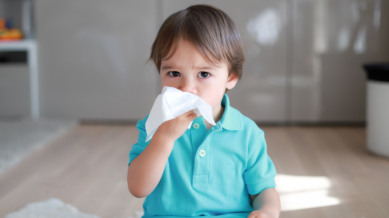 Child blowing his nose