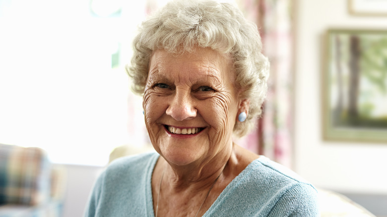 smiling senior woman on couch
