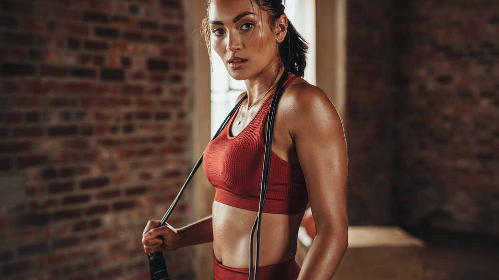 woman holding jump rope