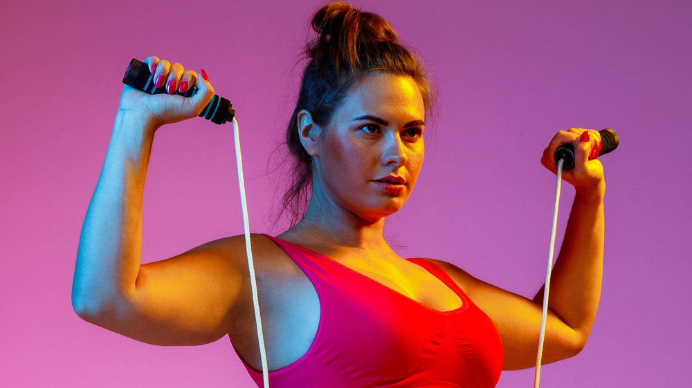 woman holding jump rope