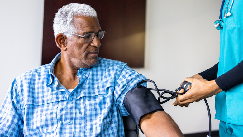 Older man getting blood pressure reading
