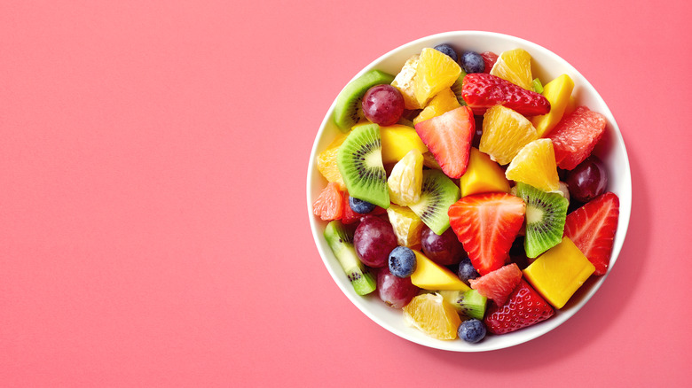 pretty fruit salad on pink background